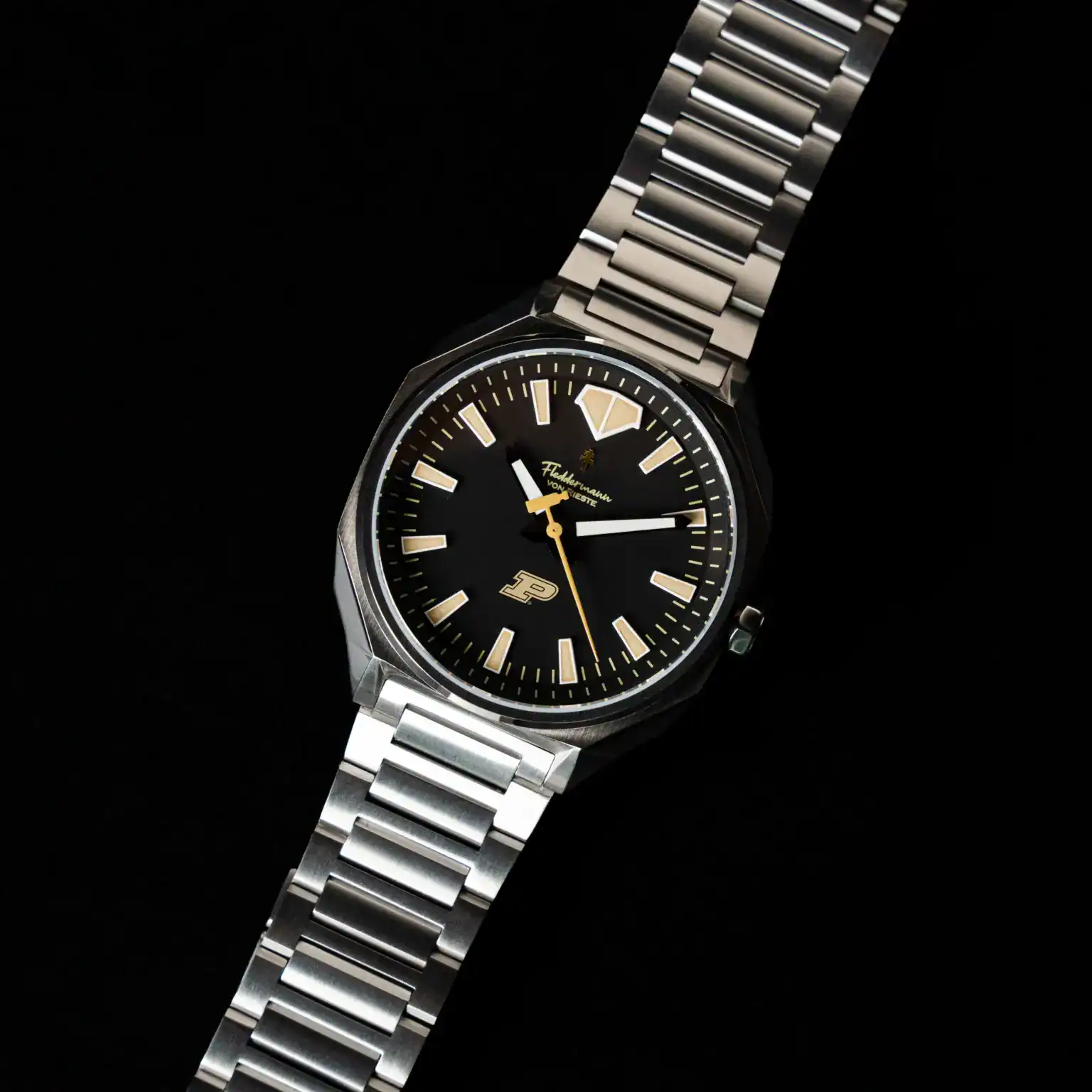 Fleddermann von Rieste Hanoverian Purdue Boilermaker Special Edition watch with black PVD case, gold dial, and steel bracelet