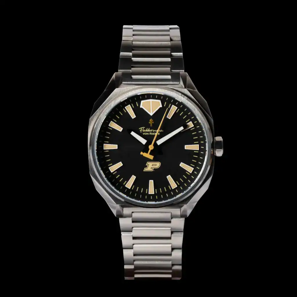 Fleddermann von Rieste Hanoverian Purdue Boilermaker Special Edition watch with black PVD case, gold dial, and steel bracelet
